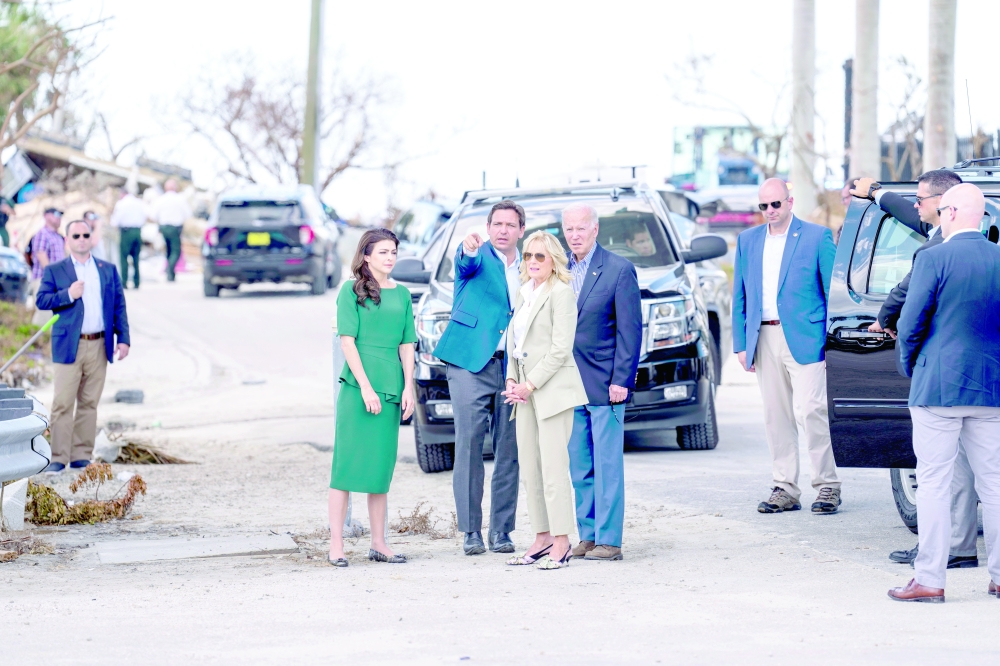 Casey Desantis and her husband, Gov Ron DeSantis, accompany first lady Jill Biden and President Joe Biden during a visit to survey storm damage in Fort Myers, Fla.
