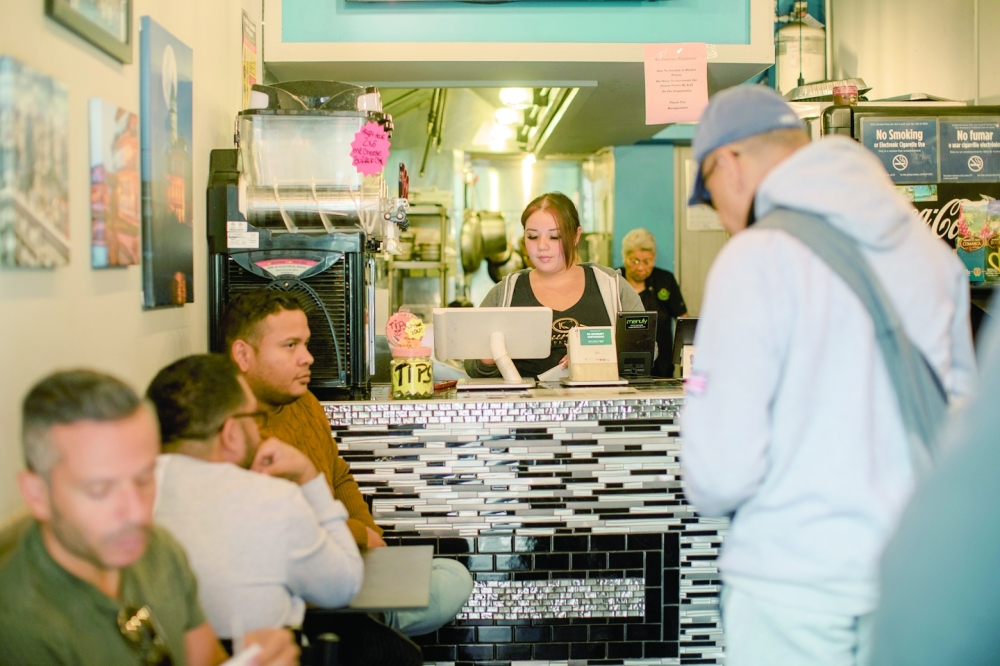 Patrons eat at KC Gourmet Empanadas in New York on Sept. 28, 2022. (José A. Alvarado Jr./The New York Times)