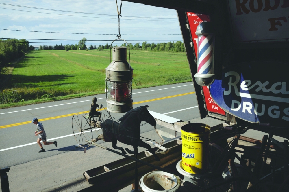 Quebec’s two-lane Route 132, seen from one of the many antique shops along the road in Bas-Saint-Laurent, Sept. 11, 2022. (Nasuna Stuart-Ulin/The New York Times)