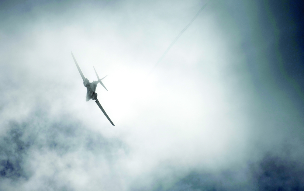 A US Air Force B-1B Lancer bomber flies through a cloud over Andersen Air Force Base, Guam. -- Reuters 