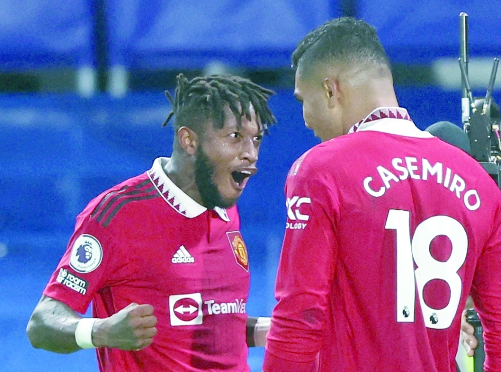 Soccer Football - Premier League - Chelsea v Manchester United - Stamford Bridge, London, Britain - October 22, 2022 Manchester United's Casemiro celebrates scoring their first goal with Fred Action Images via Reuters/Matthew Childs EDITORIAL USE ONLY. No use with unauthorized audio, video, data, fixture lists, club/league logos or 'live' services. Online in-match use limited to 75 images, no video emulation. No use in betting, games or single club /league/player publications.  Please contact your account representative for further details.
