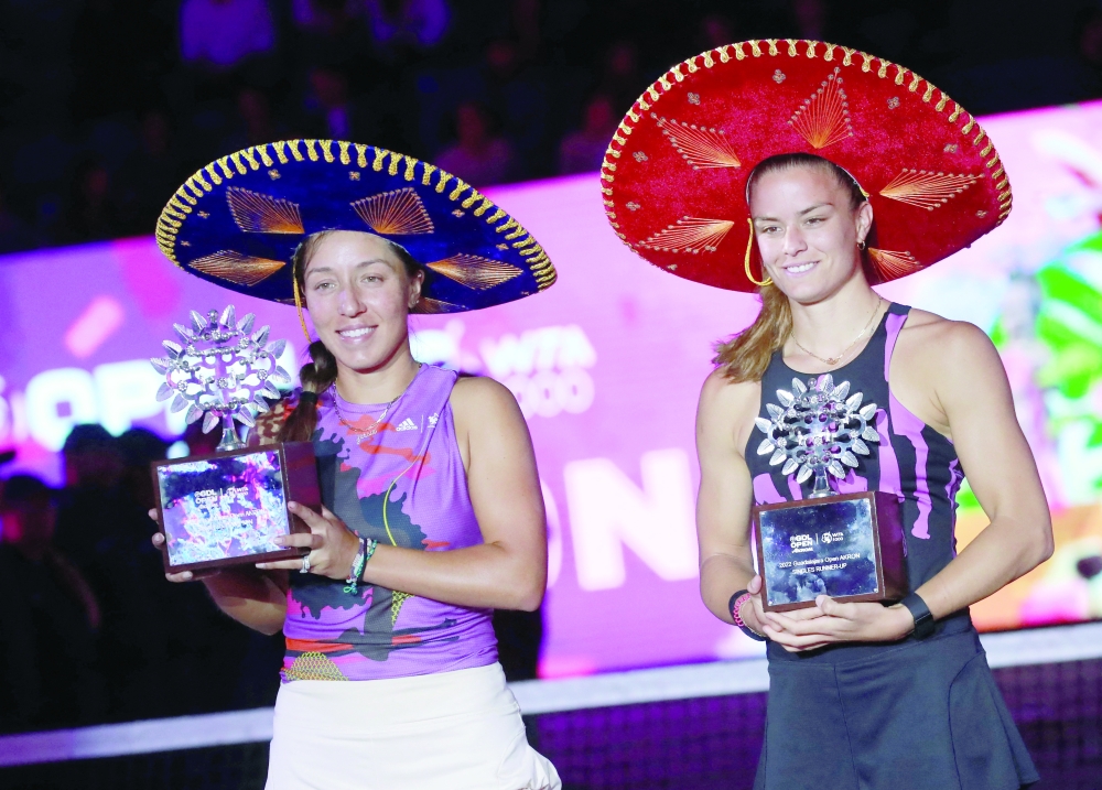 Jessica Pegula of the US and Greece's Maria Sakkari pose with their tophies after the singles final REUTERS