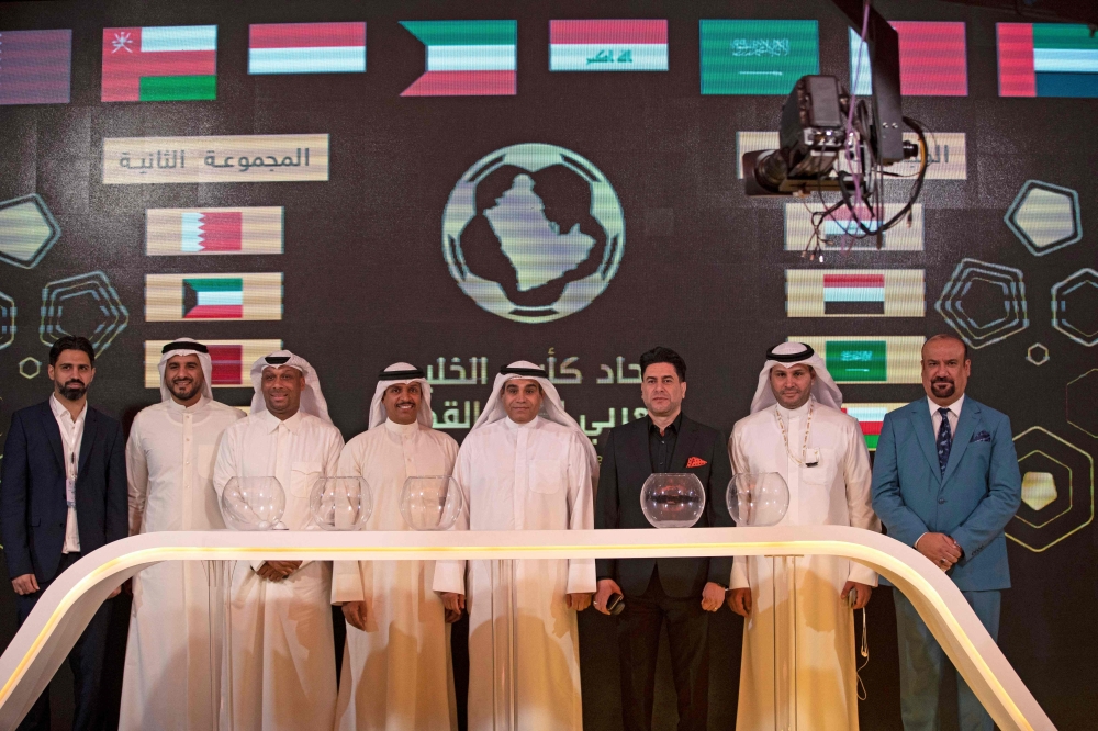 Representatives of the participant football federations attend the draw ceremony for the 25th Arabian Gulf Cup in the southern city of Basra on October 25, 2022. (Photo by Hussein Faleh / AFP)

