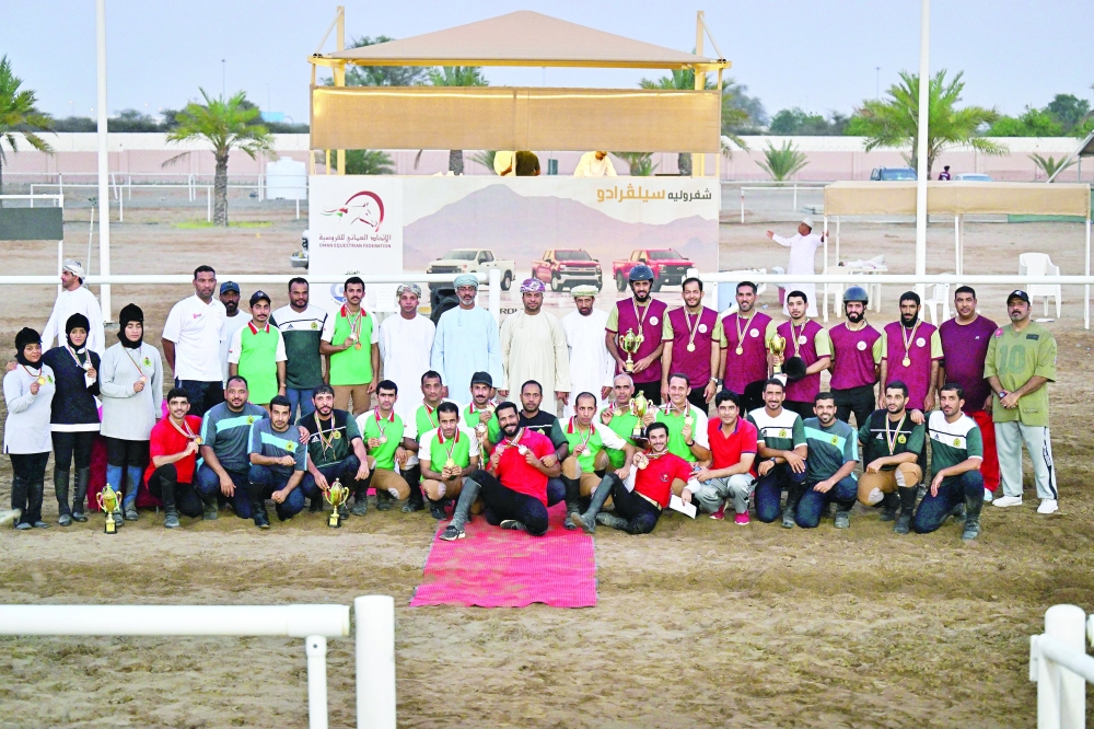 The winners with the chief guest and officials. -- Pics by Rashid al Tawki