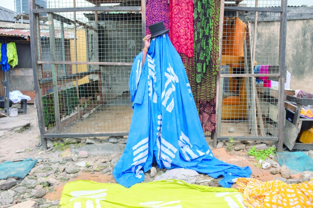 Designer Bubu Ogisi at a tie-dye workshop in Lagos, Nigeria, on Sept. 17, 2022.(Stephen Tayo/The New York Times)