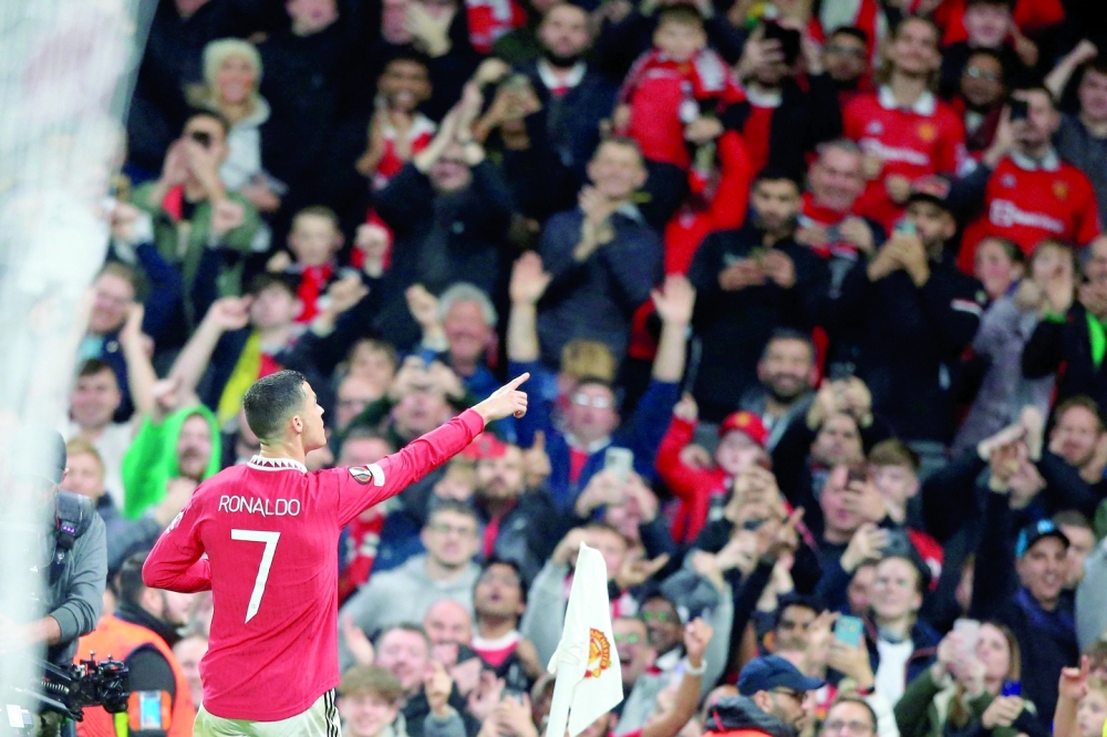 TOPSHOT - Manchester United's Portuguese striker Cristiano Ronaldo celebrates scoring the team's third goal during the UEFA Europa League Group E football match between Manchester United and Sheriff Tiraspol, at Old Trafford stadium, in Manchester, north-west England, on October 27, 2022.  (Photo by Lindsey Parnaby / AFP)

