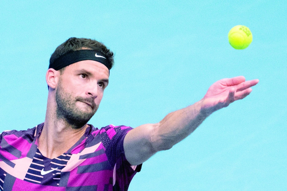 Bulgaria's Grigor Dimitrov serves the ball to Russia's Daniil Medvedev (not pictured) during the semi-final match of the ATP Vienna Open tennis tournament in Vienna, Austria, on October 29, 2022.  (Photo by GEORG HOCHMUTH / AFP)

