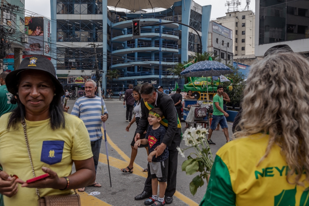 Jos Luiz Chaves Fonseca, a supporter and impersonator of Jair Bolsonaro at the Brazilian presidents re-election campaign rally in Rio de Janeiro on Oct. 14, 2022. (Maria Magdalena Arrellaga/The New York Times).