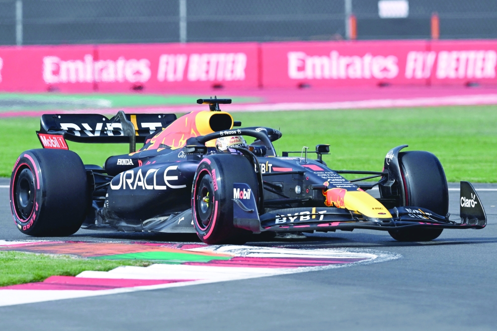 TOPSHOT - Red Bull Racing's Dutch driver Max Verstappen takes a turn as he races during the qualifying session for the Formula One Mexico Grand Prix at the Hermanos Rodriguez racetrack in Mexico City on October 29, 2022.
  (Photo by Rodrigo ARANGUA / AFP)

