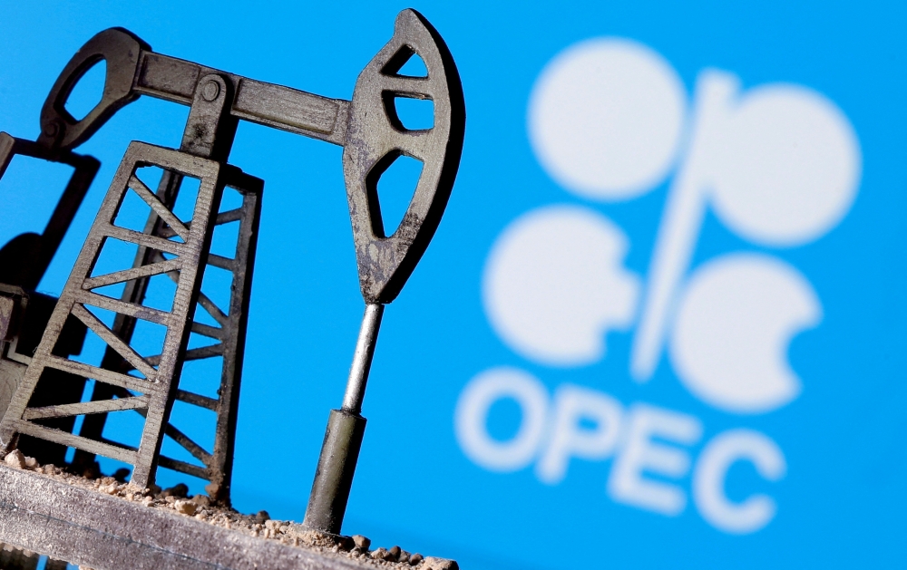 A 3D-printed oil pump jack in front of the Opec logo in this illustration picture. — Reuters