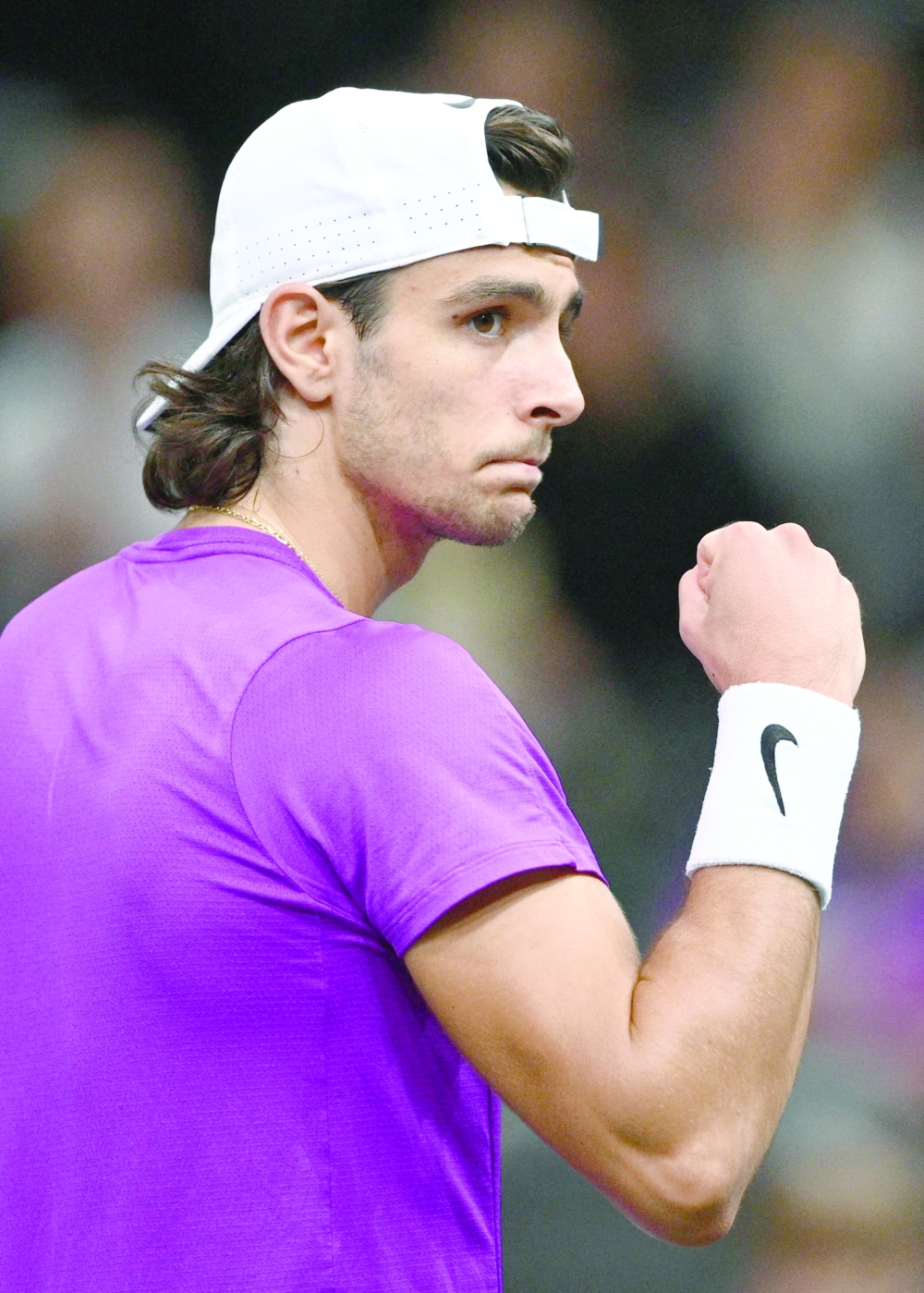 Italy's Lorenzo Musetti celebrates after winning against Norway's Casper Ruud at the end of their men's singles round of 8 tennis match on day four of the ATP World Tour Masters 1000 - Paris Masters (Paris Bercy) - indoor tennis tournament at The AccorHotels Arena in Paris on November 3, 2022.  (Photo by Christophe ARCHAMBAULT / AFP)

