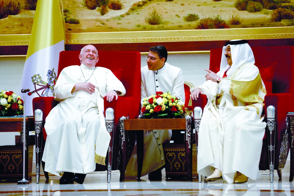 Pope Francis reacts during a meeting with Bahrain's King Hamad bin Isa al Khalifa in the Sakhir Palace. -- Reuters