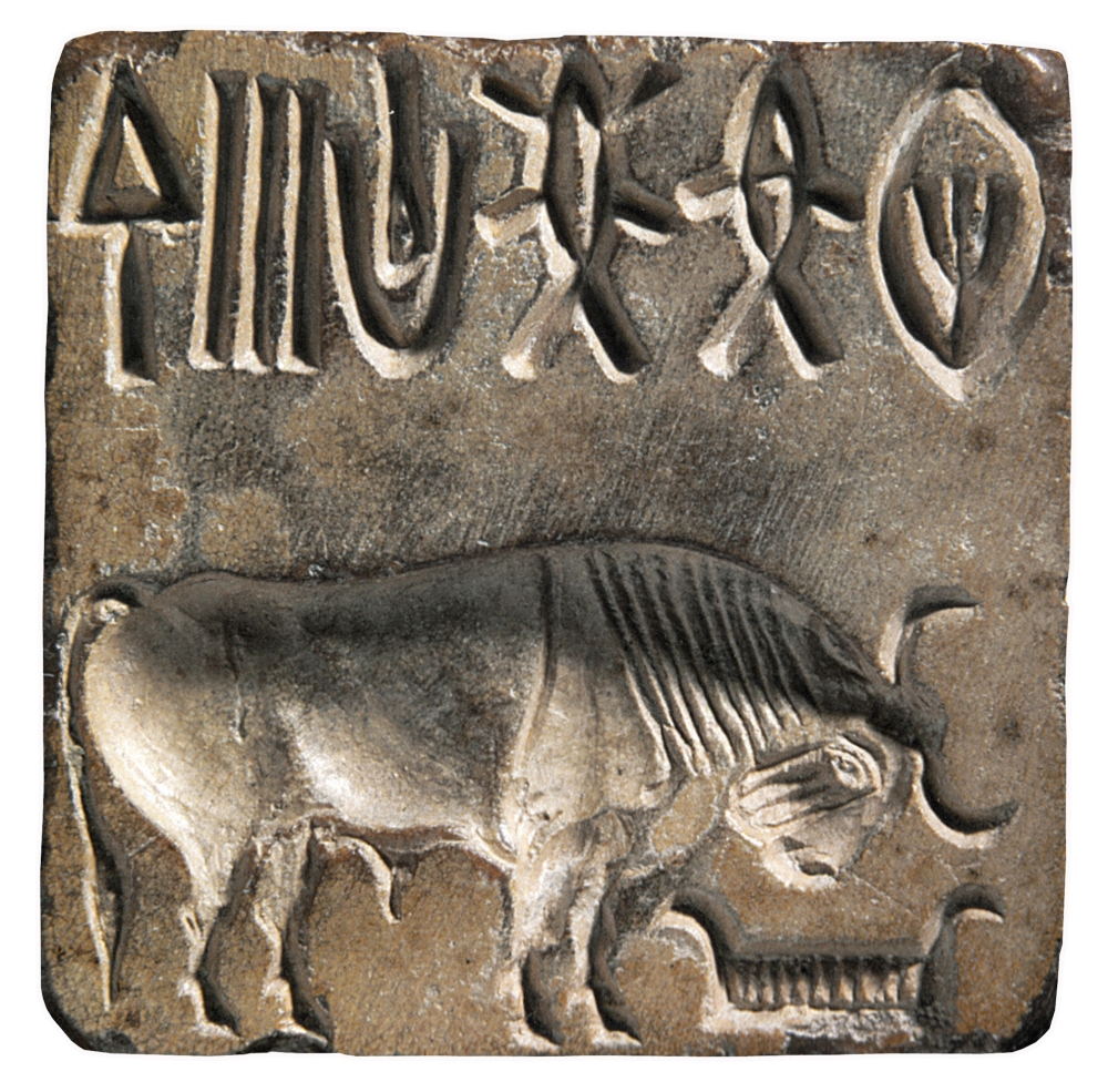Stone seal from Mohenjo-Daro (Sindh, Pakistan) with the same image of an Indian bison with the head lowered on a manger 