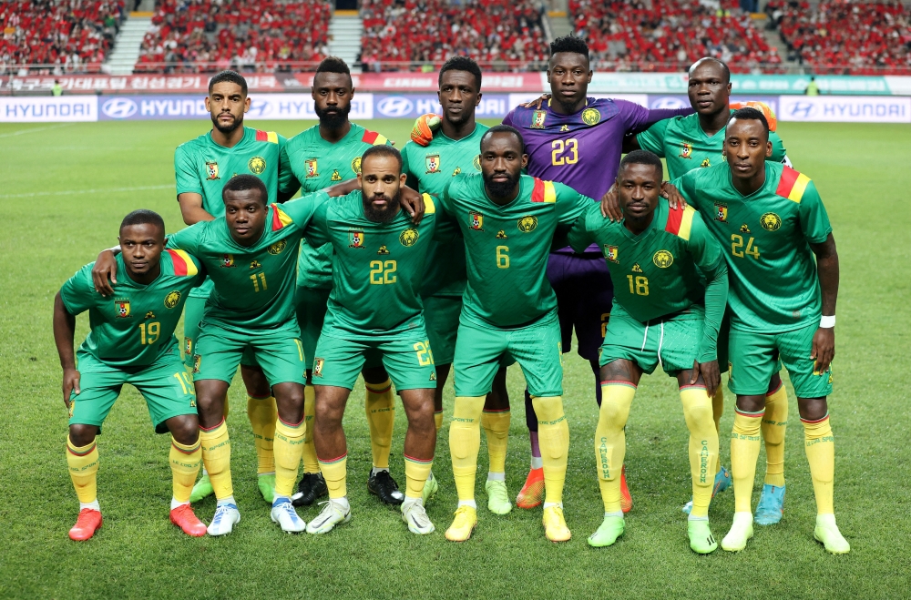 Cameroon players pose for a team group photo