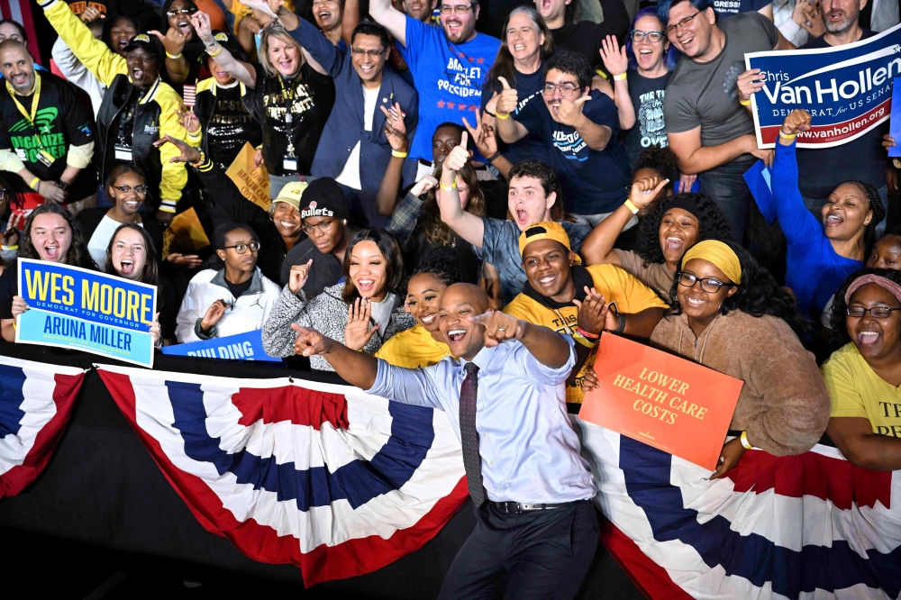 Gubernatorial candidate Wes Moore poses for pictures with supporters during a rally with US President Joe Biden at Bowie State University in Bowie, Maryland, on Monday. - AFP