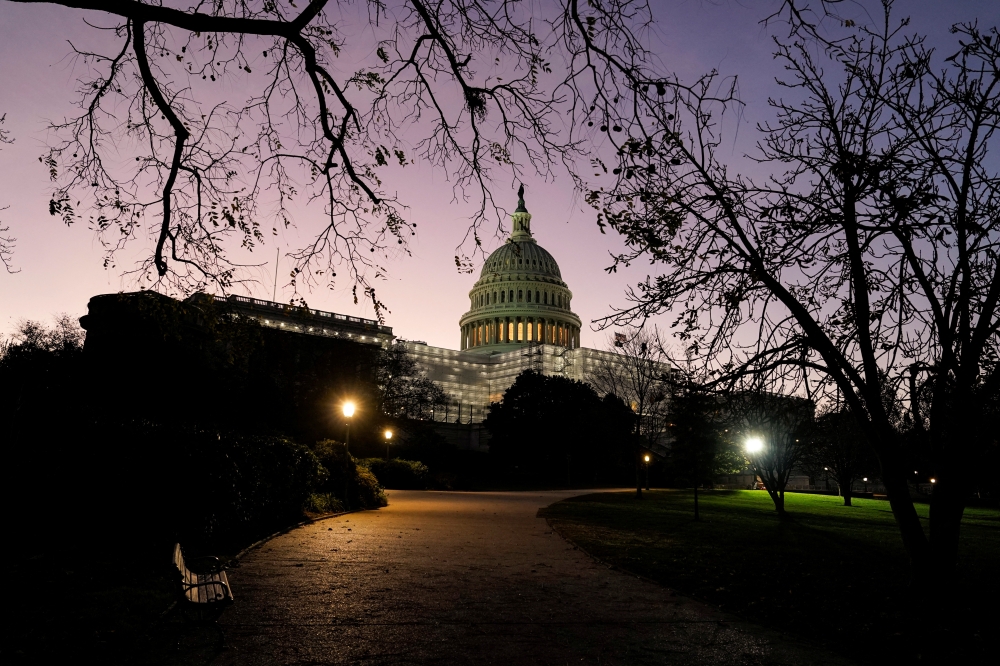 The sun rises at the U.S. Capitol on the morning of U.S. midterm elections, as control of Congress remained unclear in Washington, U.S., November 8, 2022. REUTERS/Joshua Roberts
