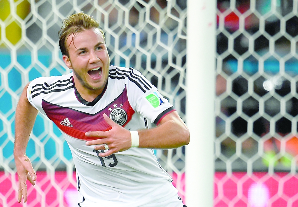 (FILES) In this file photo taken on July 13, 2014 Germany's forward Mario Goetze celebrates after scoring the winning 1-0 goal during the second half of extra-time during the 2014 FIFA World Cup final football match between Germany and Argentina at the Maracana Stadium in Rio de Janeiro, Brazil.  German midfielder Mario Goetze will be part of Germany's 26-man World Cup squad, the German head coach announced on November 10, 2022. (Photo by Odd ANDERSEN / AFP)

