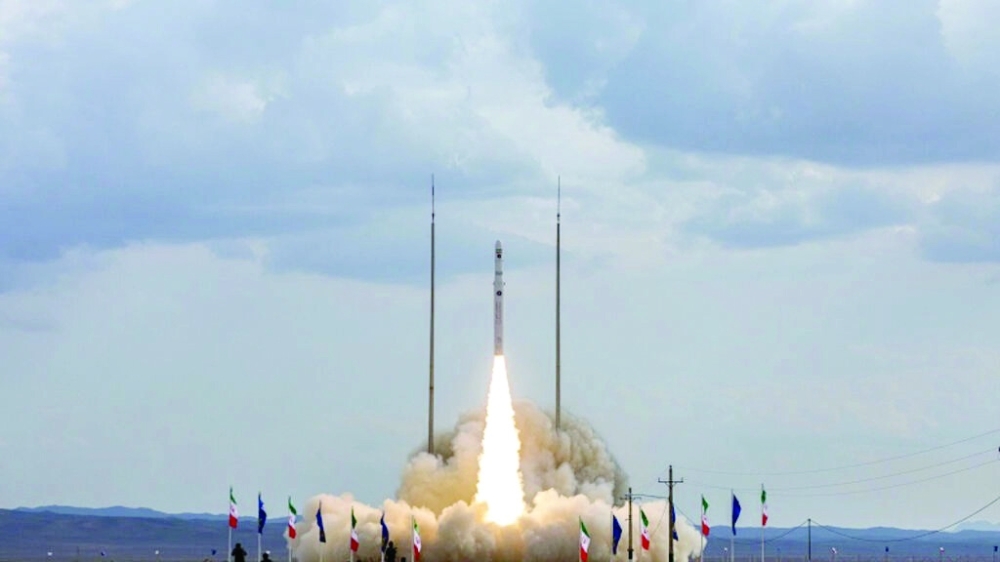Iran has successfully test-launched a three-stage solid-fuel rocket capable of carrying satellites into space on November 5, one of a series of recent advances it has boasted in its aerospace programme. -- AFP
