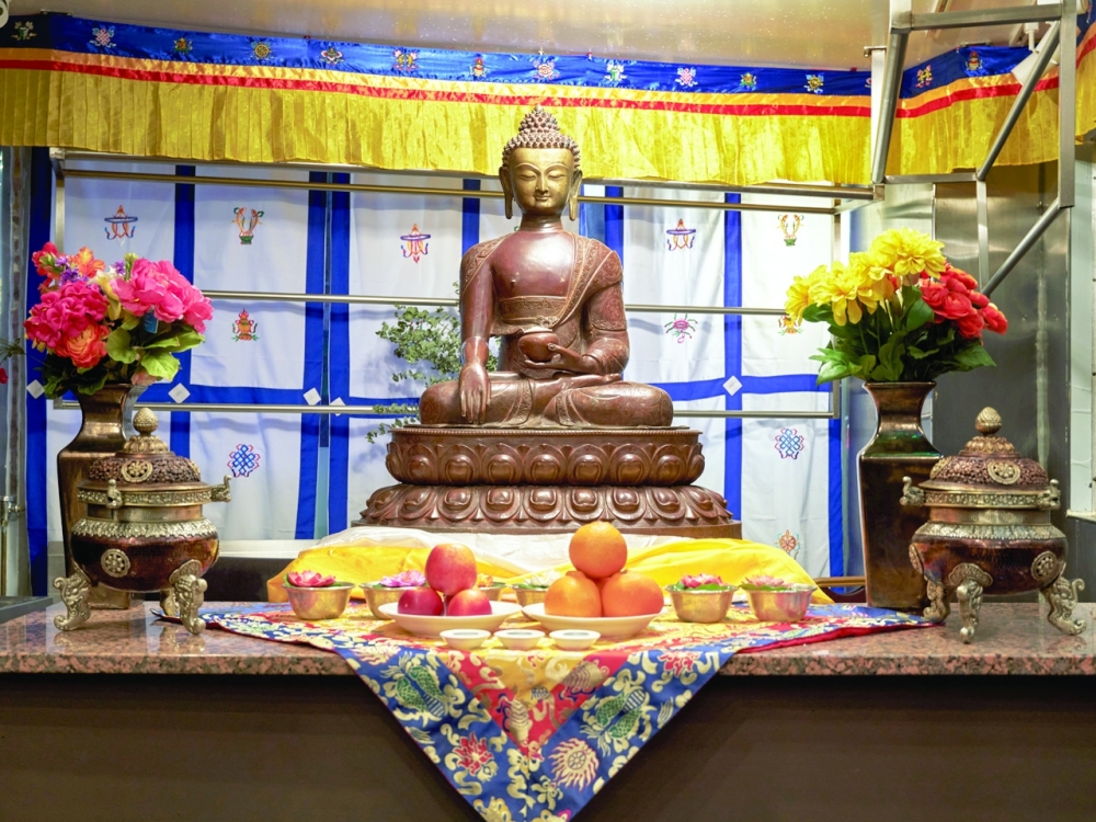 Offerings of fresh fruit and water are left for Buddha at Nha Sang in Queens, Nov. 2, 2022. (Adam Friedlander/The New York Times)
