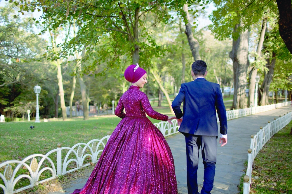 A couple explores the gardens at Hidiv Kasri as they take photos for their upcoming wedding, in Istanbul in November 2019. (Danielle Villasana/The New York Times)