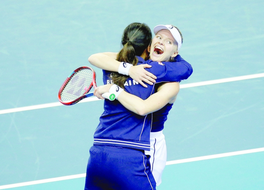 Tennis - Billie Jean King Cup Finals - Emirates Arena, Glasgow, Scotland, Britain - November 10, 2022 Britain's Harriet Dart celebrates with captain Anne Keothavong after winning her match in the group stage against Spain's Paula Badosa Action Images via Reuters/Ed Sykes     TPX IMAGES OF THE DAY
