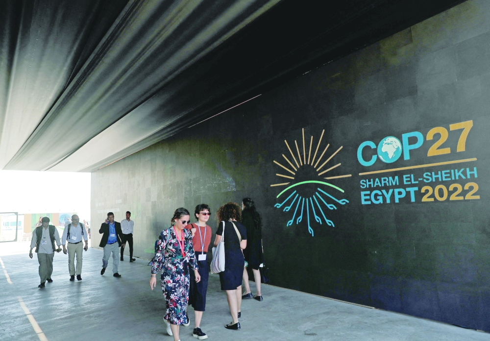 People attend the COP27 climate conference in Sharm el-Sheikh. -- AFP
