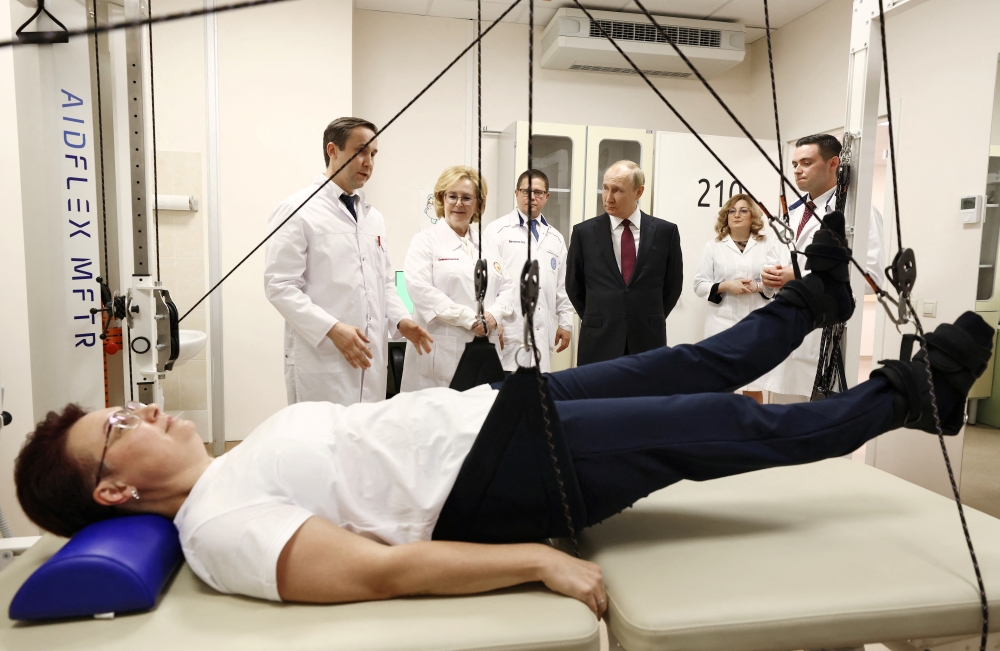 Russian President Vladimir Putin visits the Federal Centre for Brain and Neurotechnologies of the Federal Medical-Biological Agency in Moscow. -- Reuters