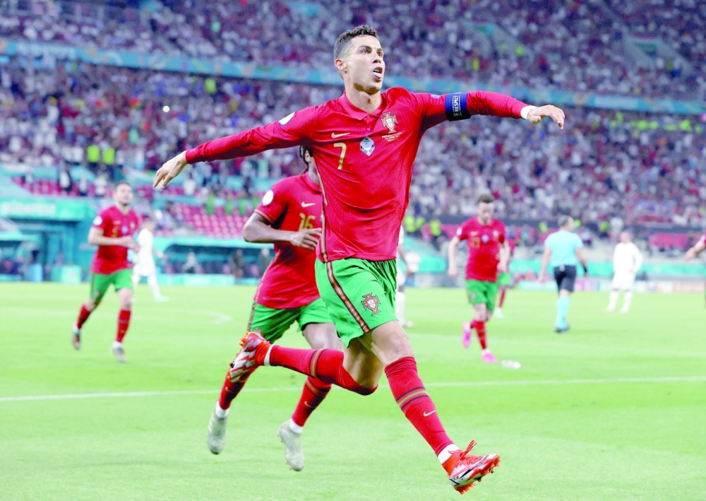 FILE PHOTO: Soccer Football - Euro 2020 - Group F - Portugal v France - Puskas Arena, Budapest, Hungary - June 23, 2021 Portugal's Cristiano Ronaldo celebrates scoring their second goal Pool via REUTERS/Bernadett Szabo/File Photo

