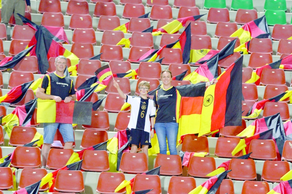 German fans pose at the Sultan Qaboos Sports Complex. -- AbdulWahid al Hamadani