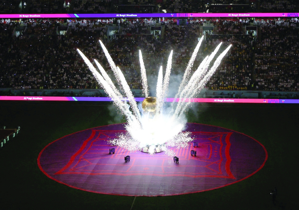 Soccer Football - FIFA World Cup Qatar 2022 - Group A - Qatar v Ecuador - Al Bayt Stadium, Al Khor, Qatar - November 20, 2022 A FIFA World Cup trophy replica is seen on the pitch before the match REUTERS/Molly Darlington
