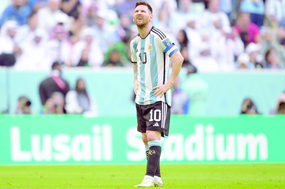 Argentina's forward #10 Lionel Messi reacts during the Qatar 2022 World Cup Group C football match between Argentina and Saudi Arabia at the Lusail Stadium in Lusail, north of Doha on November 22, 2022. (Photo by JUAN MABROMATA / AFP)

