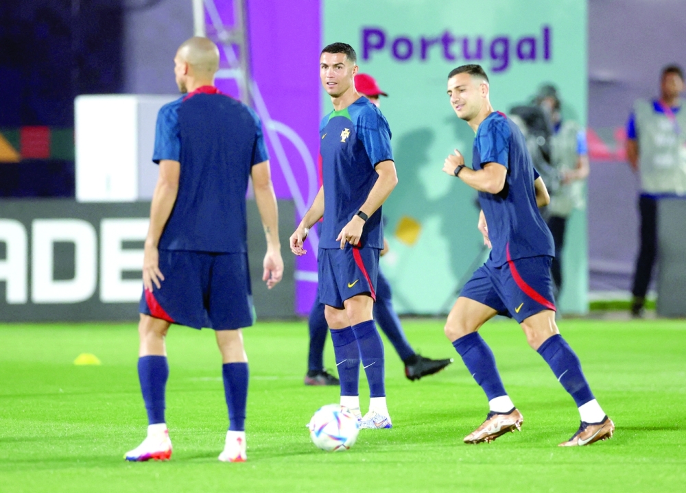 Soccer Football - FIFA World Cup Qatar 2022 - Portugal Training - Al Shahaniya SC Training Facilities, Al-Shahaniya, Qatar - November 23, 2022 Portugal's Cristiano Ronaldo and teammates during training REUTERS/Paul Childs
