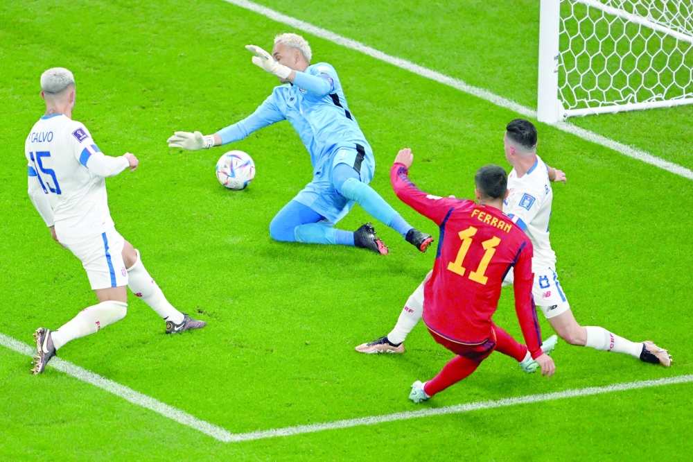 TOPSHOT - Spain's forward #11 Ferran Torres (front R) scores his team's fourth goal during the Qatar 2022 World Cup Group E football match between Spain and Costa Rica at the Al-Thumama Stadium in Doha on November 23, 2022.   (Photo by Kirill KUDRYAVTSEV / AFP)

