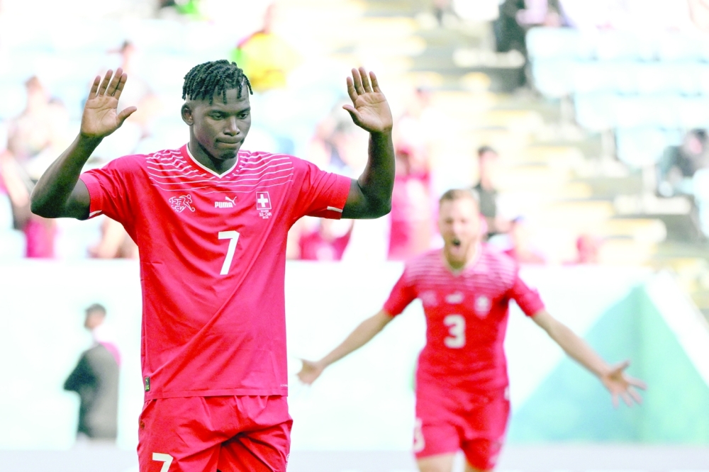 Switzerland's forward #07 Breel Embolo celebrates scoring his team's first goal during the Qatar 2022 World Cup Group G football match between Switzerland and Cameroon at the Al-Janoub Stadium in Al-Wakrah, south of Doha on November 24, 2022. (Photo by FABRICE COFFRINI / AFP)

