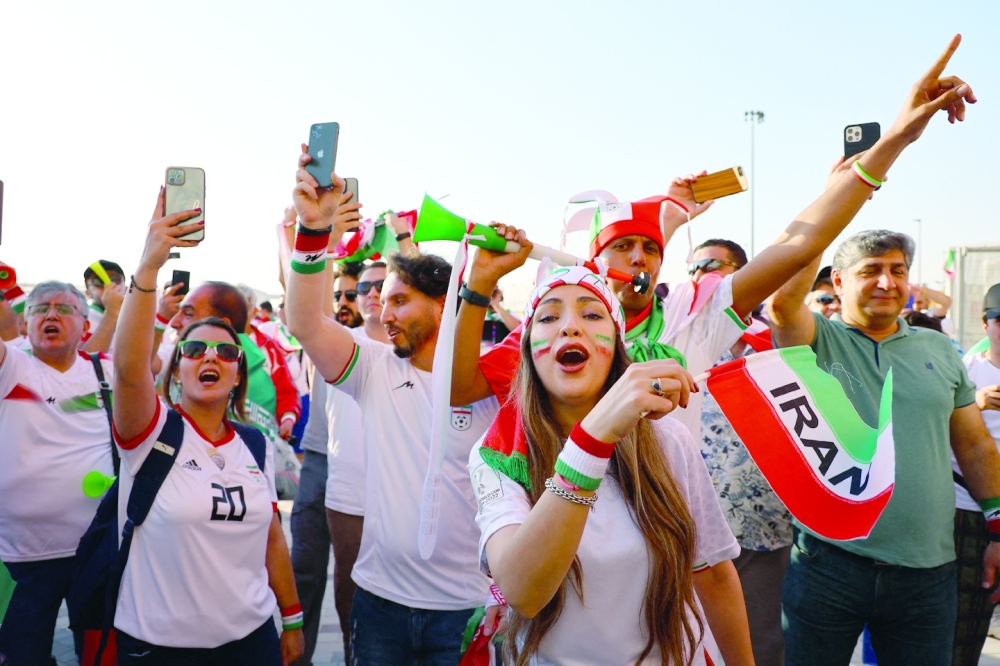 Soccer Football - FIFA World Cup Qatar 2022 - Group B - Wales v Iran - Ahmad Bin Ali Stadium, Al Rayyan, Qatar - November 25, 2022     Iran fans celebrate outside the stadium after the match REUTERS/Fabrizio Bensch

