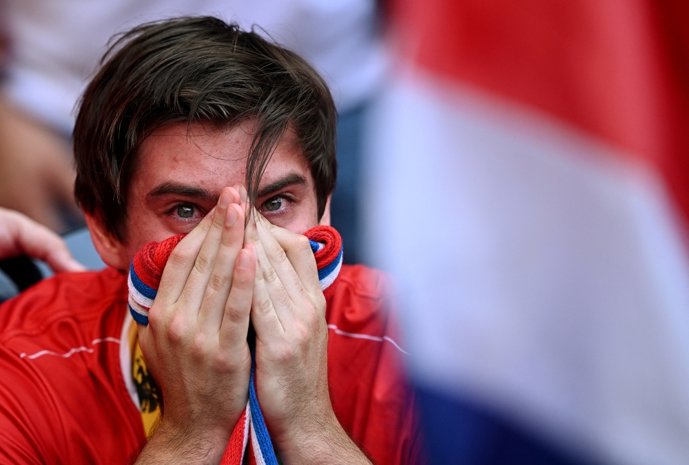 Costa Rica fan reacts after the match 