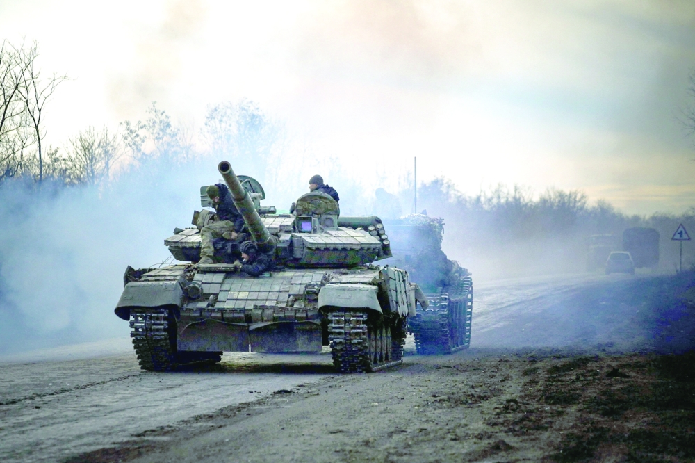 A Ukrainian tank rolls on a road near Bakhmut, in the Donetsk region, amid the Russian war of Ukraine. -- AFP