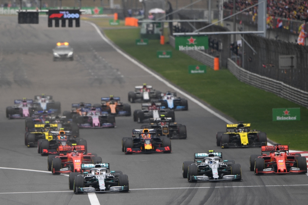 (FILES) This file photo taken on April 14, 2019 shows drivers setting off at the start of the Formula One Chinese Grand Prix in Shanghai. Next year's China Grand Prix has been cancelled Formula One announced on December 2, 2022 making it four successive years it will not have been raced due to the coronavirus pandemic. (Photo by Greg Baker / AFP)

