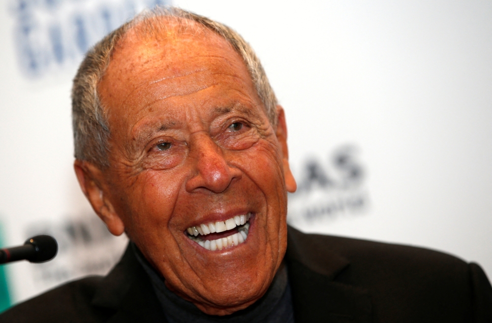 FILE PHOTO: Tennis coach Nick Bollettieri laughs during a news conference where he was introduced as one of the five new inductees to the International Tennis Hall of Fame in New York, March 3, 2014. REUTERS/Mike Segar/File Photo
