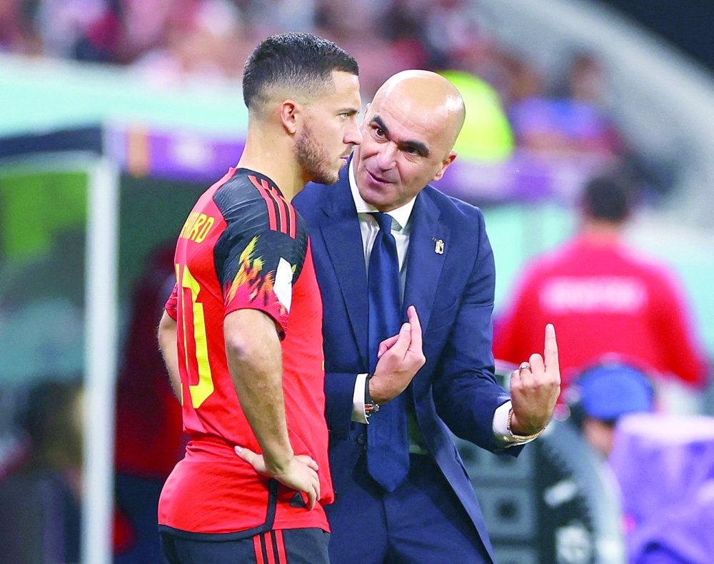 Soccer Football - FIFA World Cup Qatar 2022 - Group F - Croatia v Belgium - Ahmad Bin Ali Stadium, Al Rayyan, Qatar - December 1, 2022  Belgium coach Roberto Martinez gives instructions to Eden Hazard before he comes on as a substitute REUTERS/Bernadett Szabo
