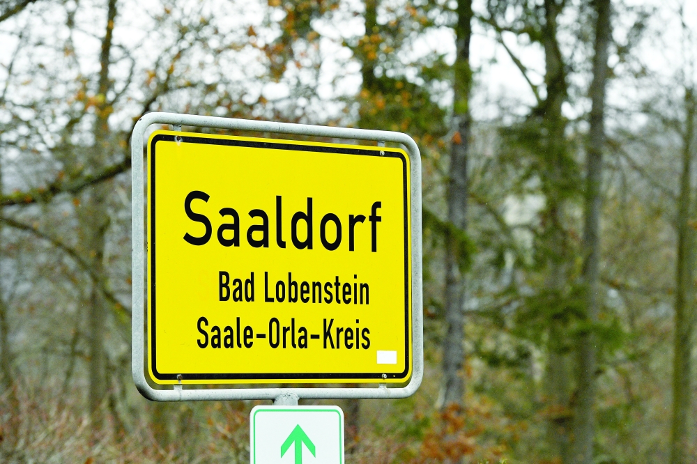 A sign indicates the town of Saaldorf, where police secured the area around the Waidmannsheil hunting lodge, in Saaldorf, Bad Lobenstein, Germany, on Thursday. - Reuters