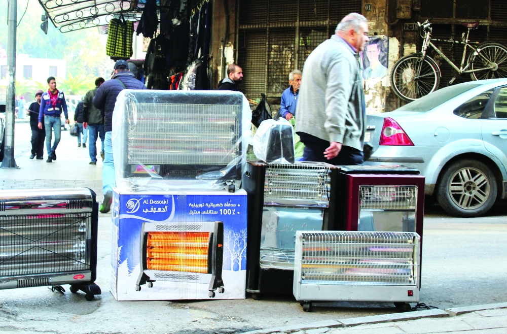 A man walks past a shop selling heaters in Damascus, Syria. - Reuters