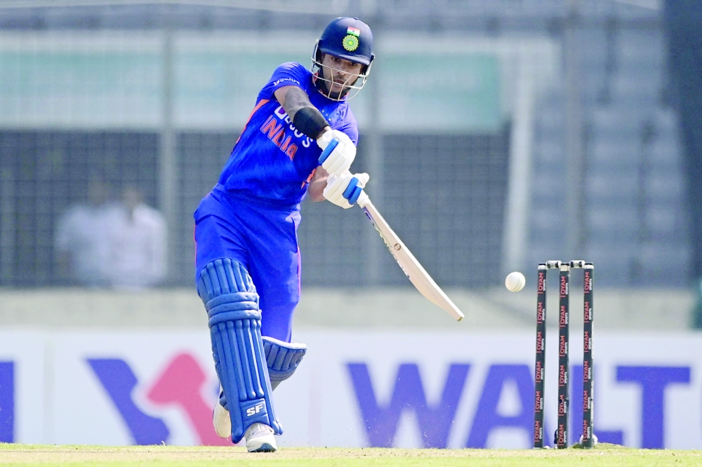Indian's Shikhar Dhawan plays a shot during the first one-day international (ODI) cricket match between Bangladesh and India at the Sher-e-Bangla National Cricket Stadium in Dhaka on December 4, 2022.  (Photo by Munir uz ZAMAN / AFP)

