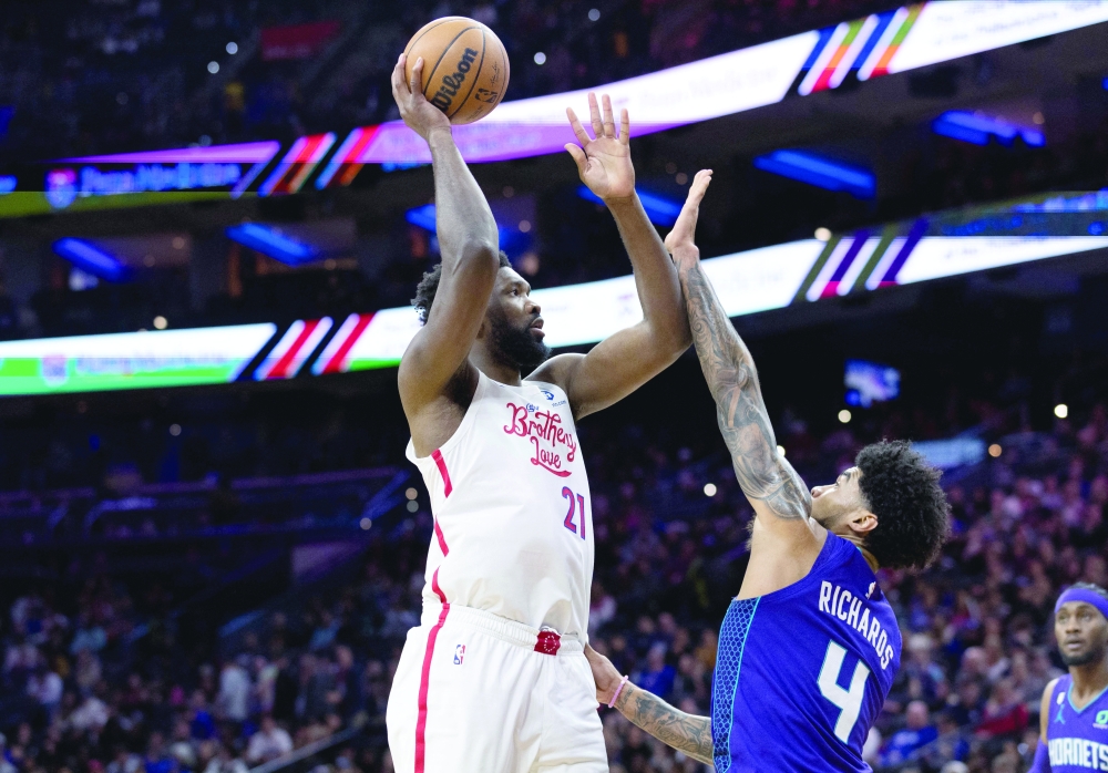 Dec 11, 2022; Philadelphia, Pennsylvania, USA; Philadelphia 76ers center Joel Embiid (21) shoots over Charlotte Hornets center Nick Richards (4) during the fourth quarter at Wells Fargo Center. Mandatory Credit: Bill Streicher-USA TODAY Sports
