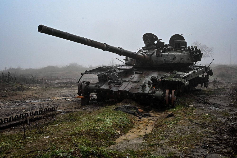 This photograph taken on December 13, 2022, shows a destroyed tank on the outskirts of the village of Kamyanka near Izyum, Kharkiv region, amid the Russian invasion of Ukraine.