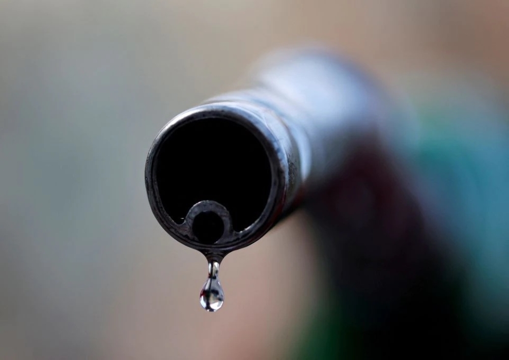 A drop of diesel is seen at the tip of a nozzle in a petrol station in Nice, France. — Reuters