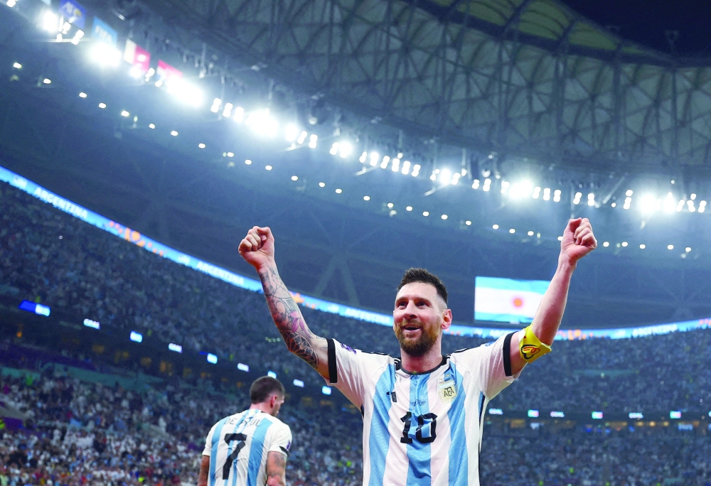 Soccer Football - FIFA World Cup Qatar 2022 - Semi Final - Argentina v Croatia - Lusail Stadium, Lusail, Qatar - December 13, 2022 Argentina's Lionel Messi celebrates their third goal scored by Julian Alvarez REUTERS/Molly Darlington     TPX IMAGES OF THE DAY
