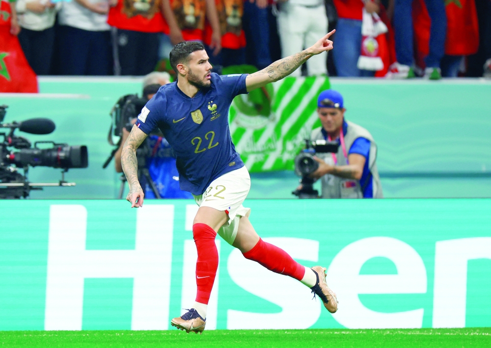 Soccer Football - FIFA World Cup Qatar 2022 - Semi Final - France v Morocco - Al Bayt Stadium, Al Khor, Qatar - December 14, 2022 France's Theo Hernandez celebrates scoring their first goal REUTERS/Molly Darlington
