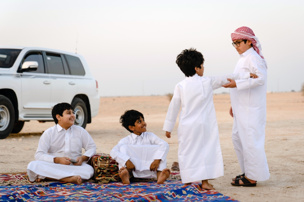 Children join older falconers as they gather for a training session for hunting competitions outside of Al Khor, Qatar, on Dec. 3, 2022. (Erin Schaff/The New York Times)