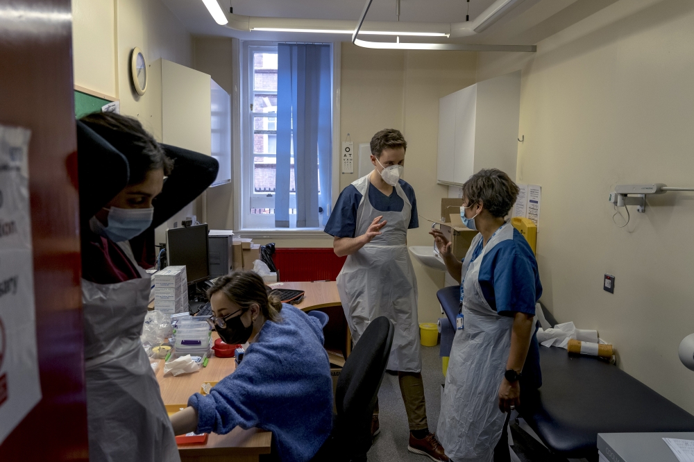 Nurses and doctors at a clinic in central London on Jan. 28, 2021. The nursing strike is one of a series of industrial actions taking place across Britain this month. (Andrew Testa/The New York Times)